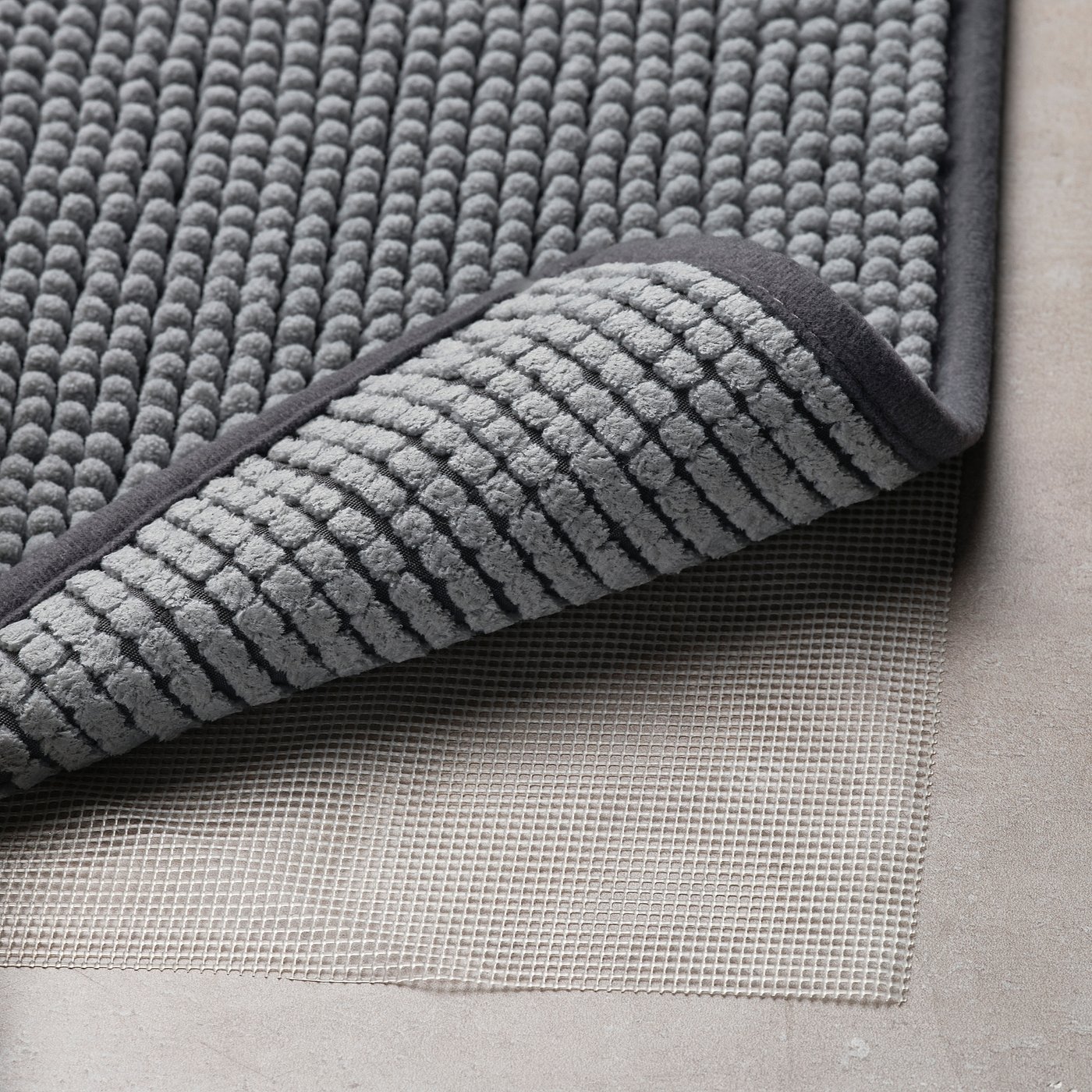 KUSTBEVAKARE tapis de bain